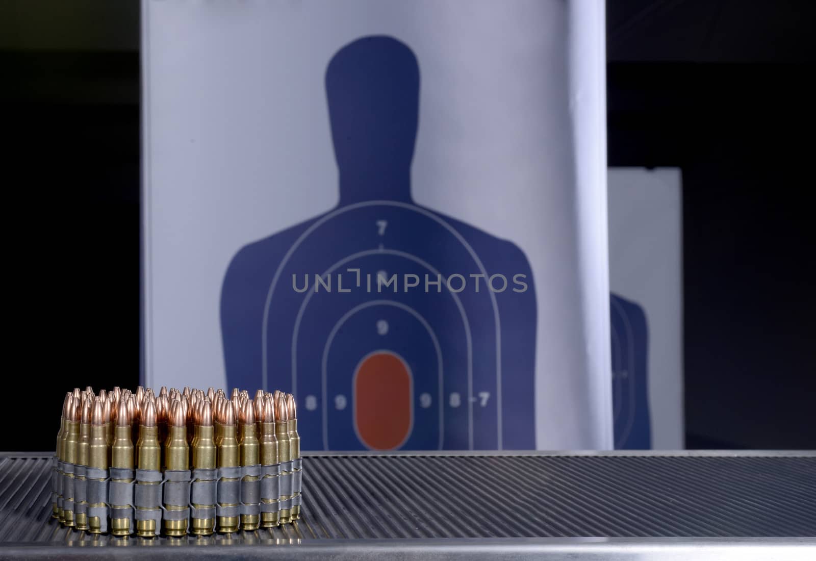 bullets and bullseye at gun range