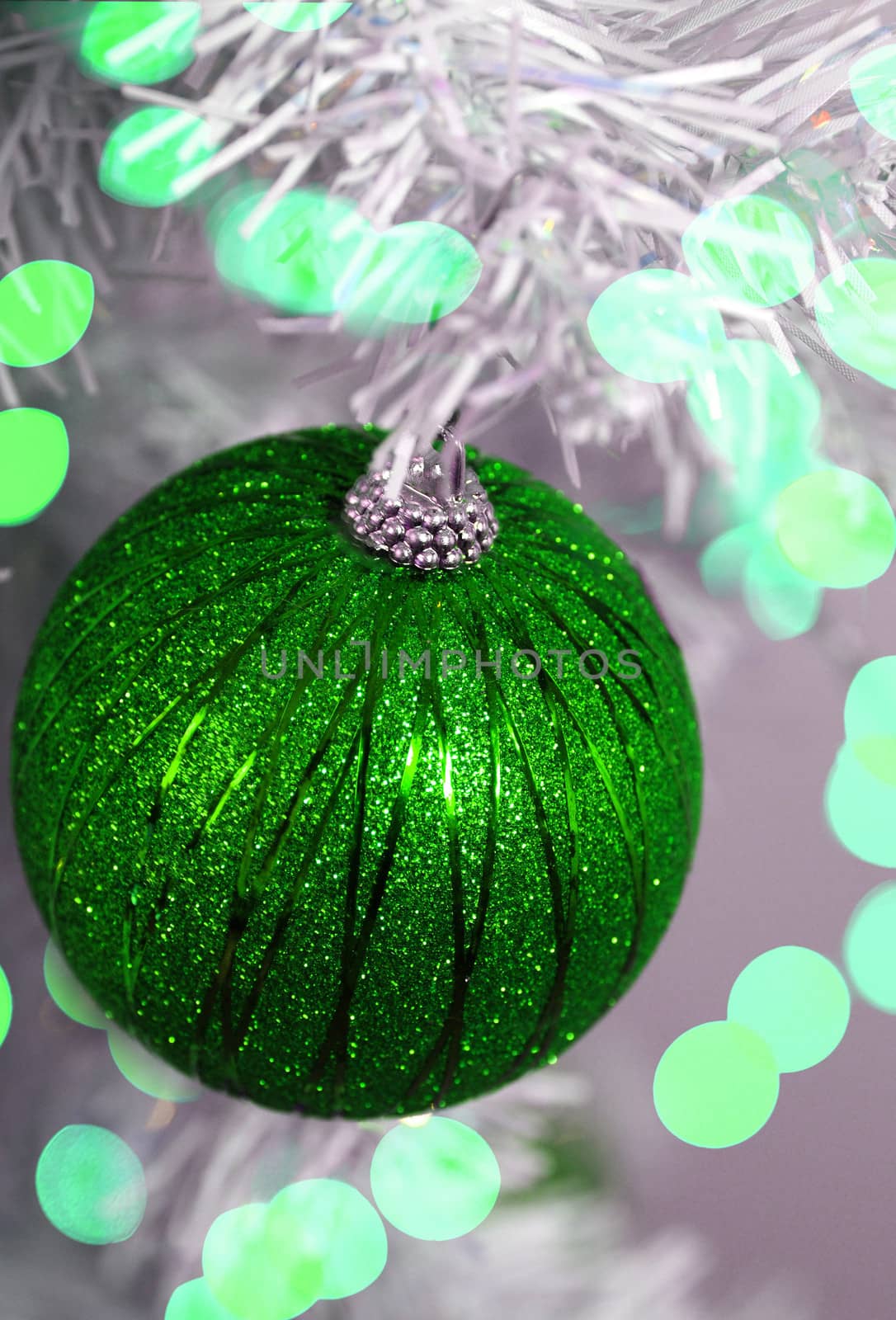 glitter green and white christmas decorations with lights and tree