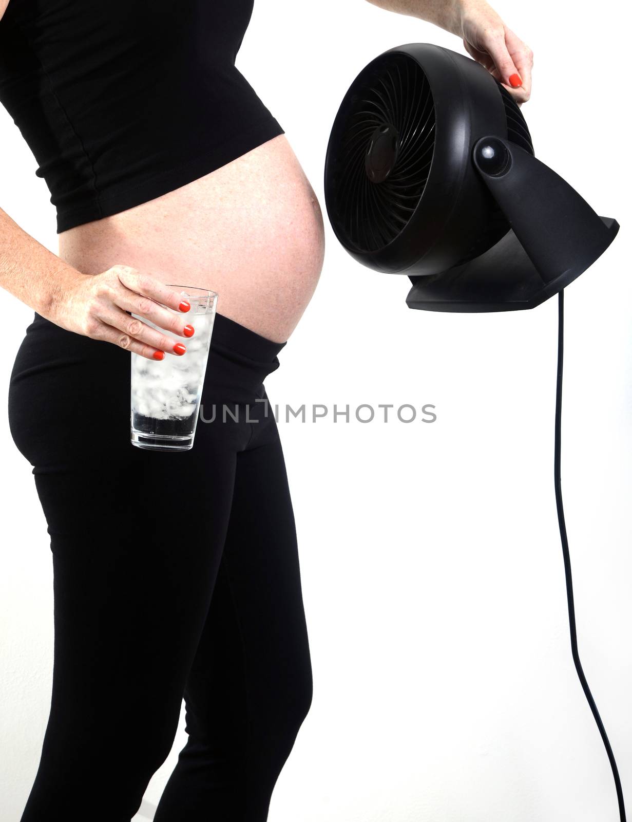 hot pregnant woman trying to cool down from hot flash during pregnancy