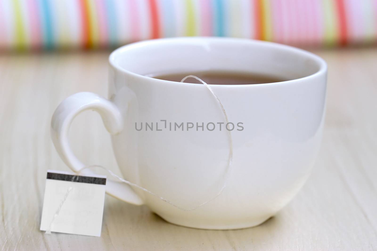 White cup of tea and tea bag