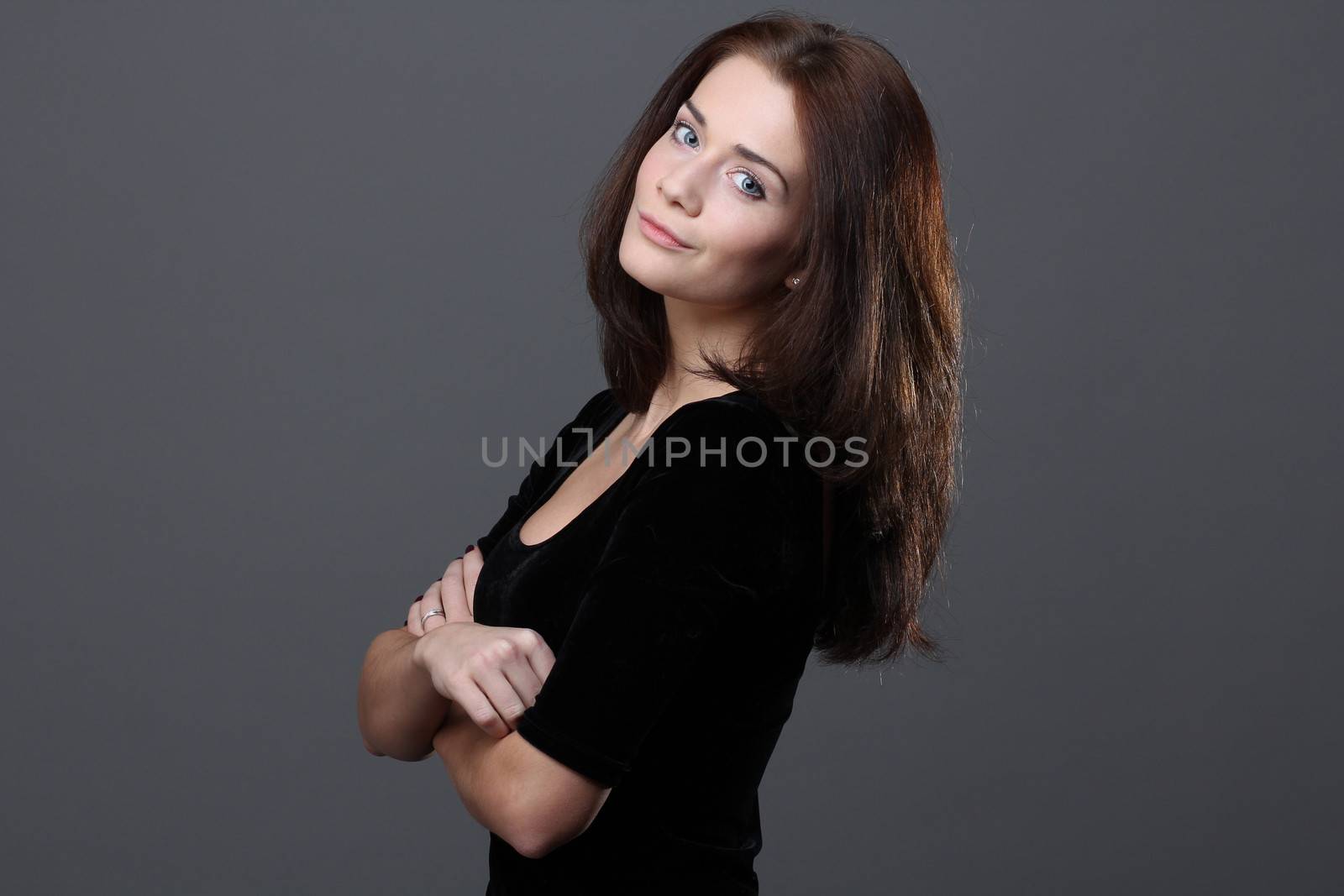 Beautiful young woman in grey background