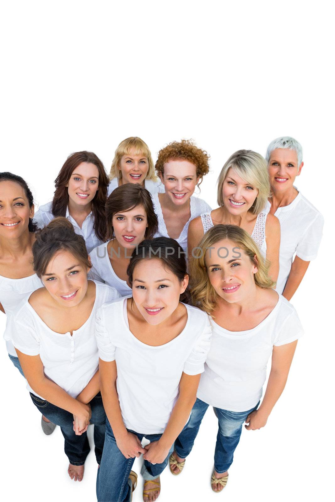 Happy female models smiling at camera on white background