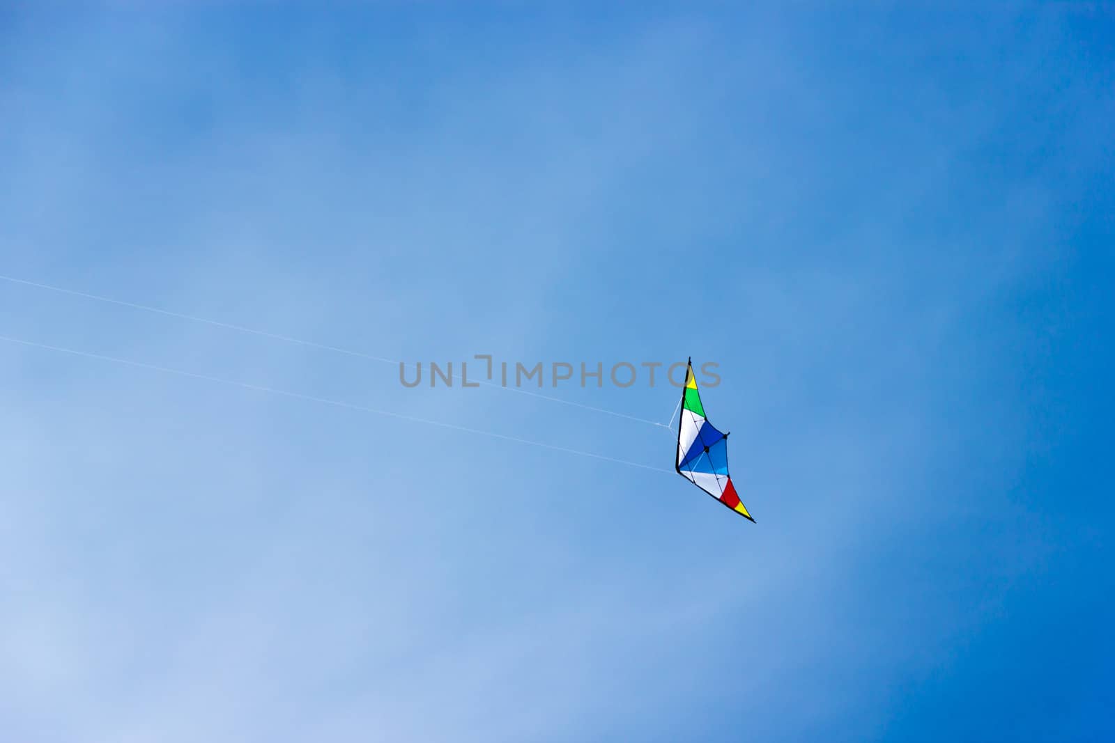 colorful kite soaring in a nice blue sky