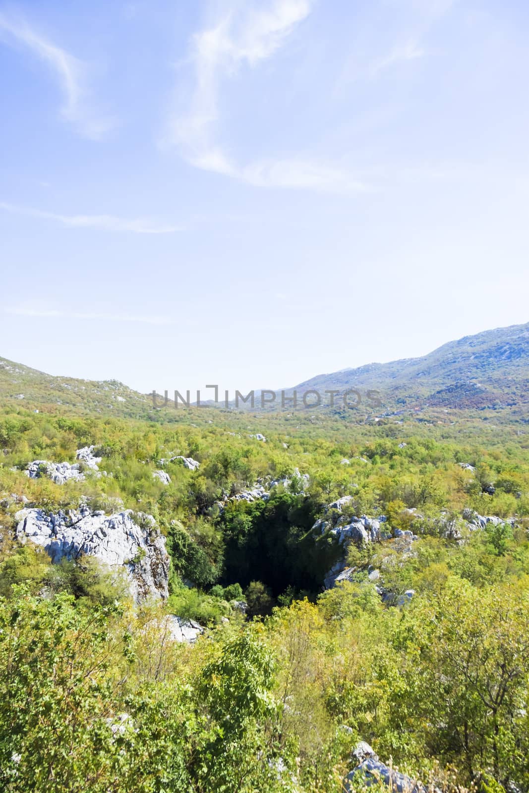the entrance to a cave in the mountains of Dalmatia, Croatia