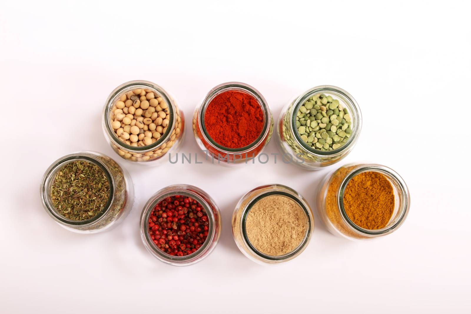 Variety of spices in a glass pot.
