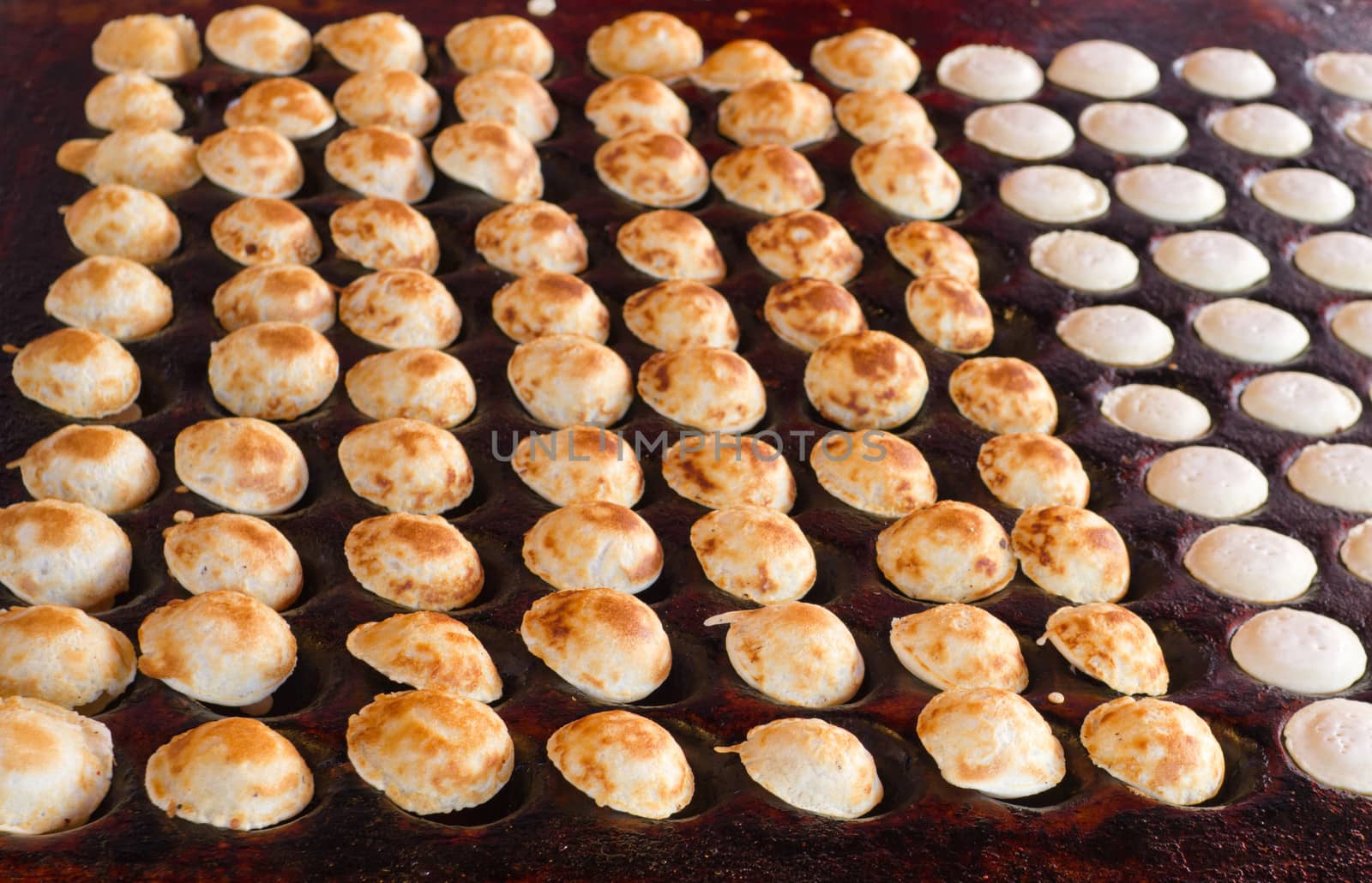 freshly baked traditional Dutch mini pancakes called "poffertjes by Tetyana