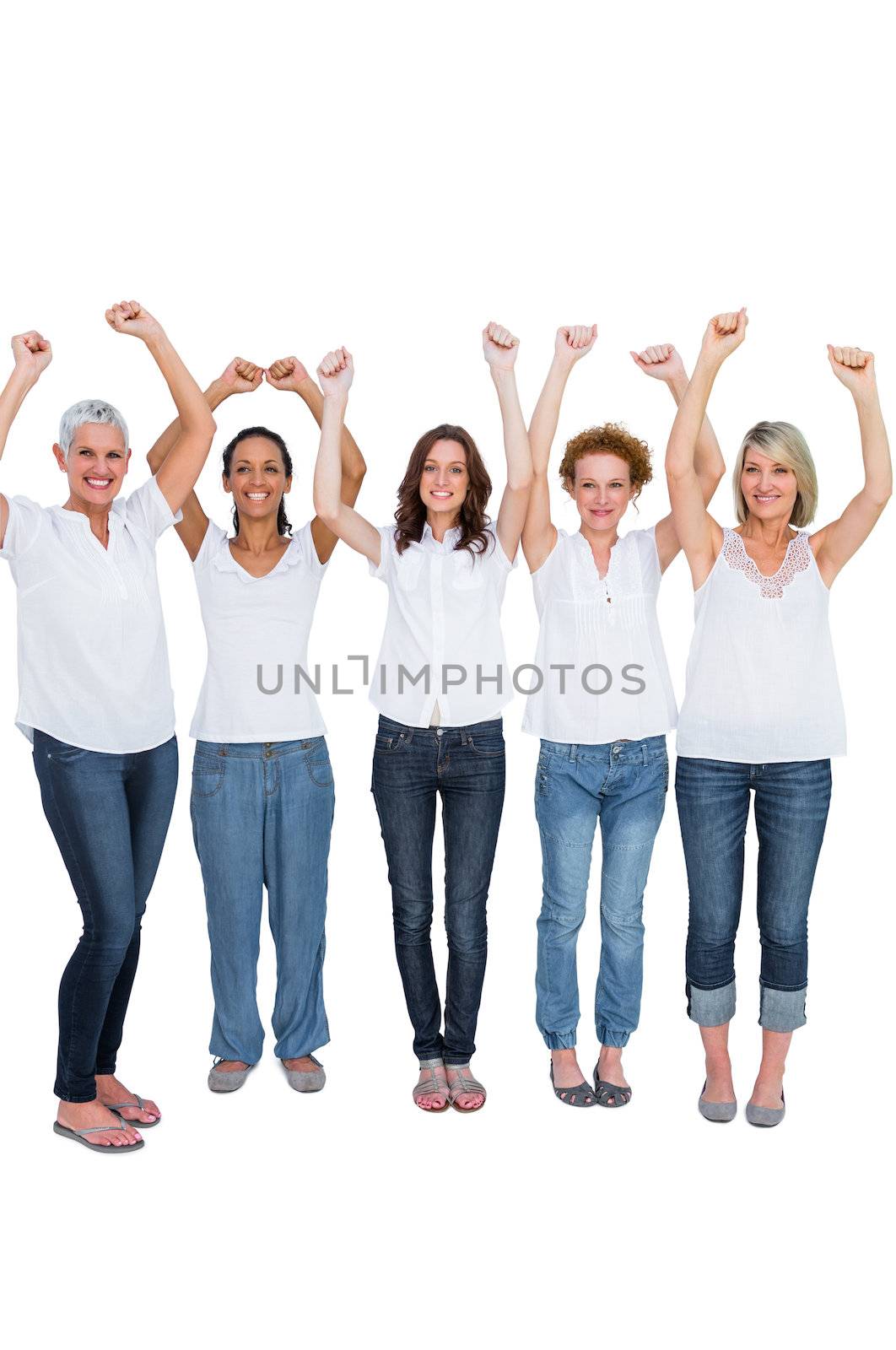 Cheerful casual models posing with hands up on white background