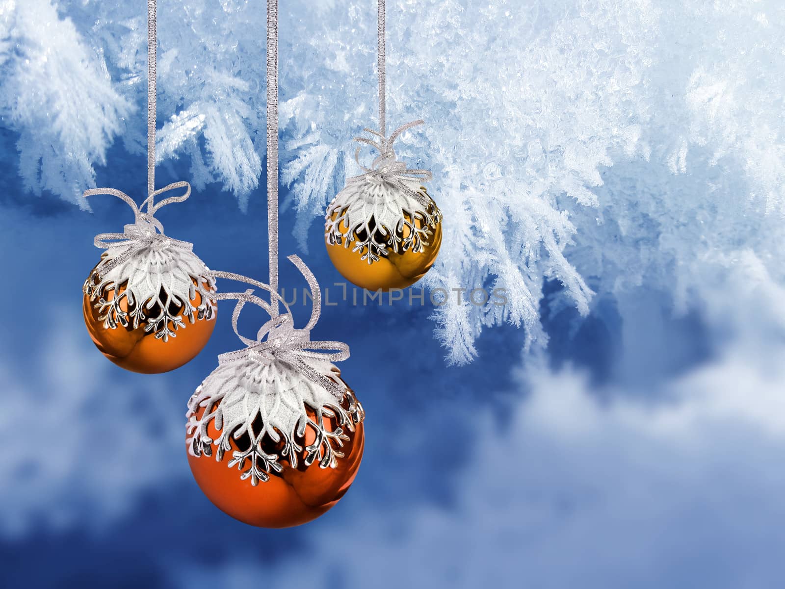 Colorful Christmas decoration balls on blue frosty background