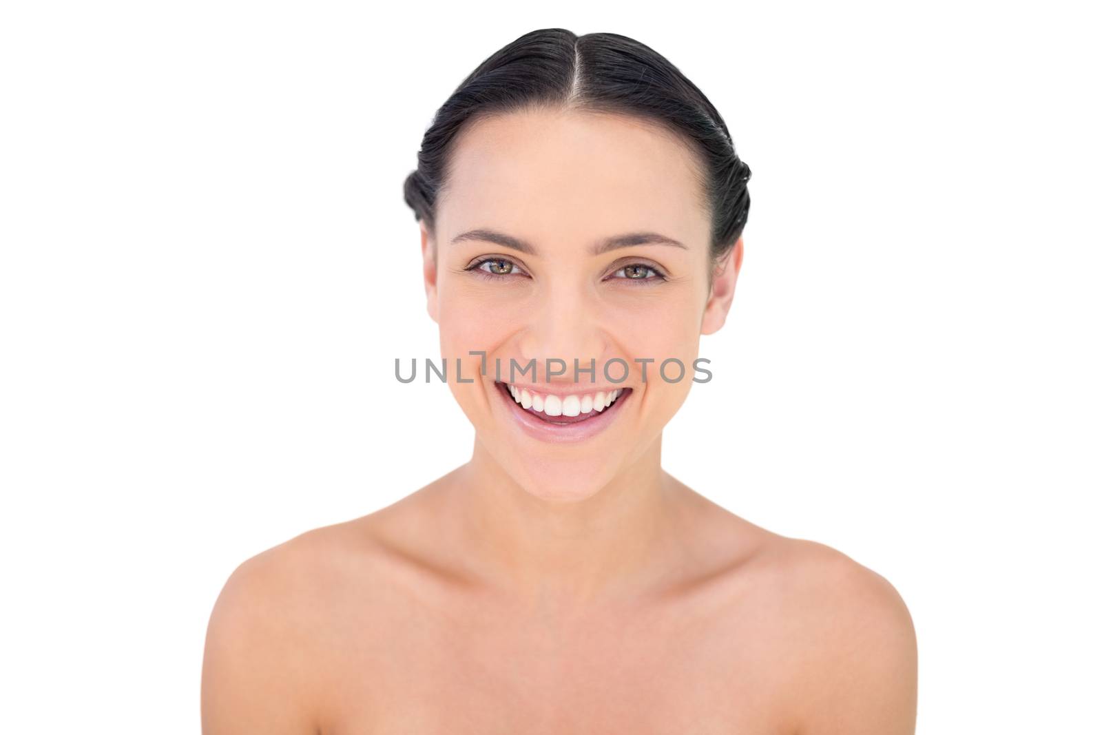 Natural beauty laughing while looking at camera on white background