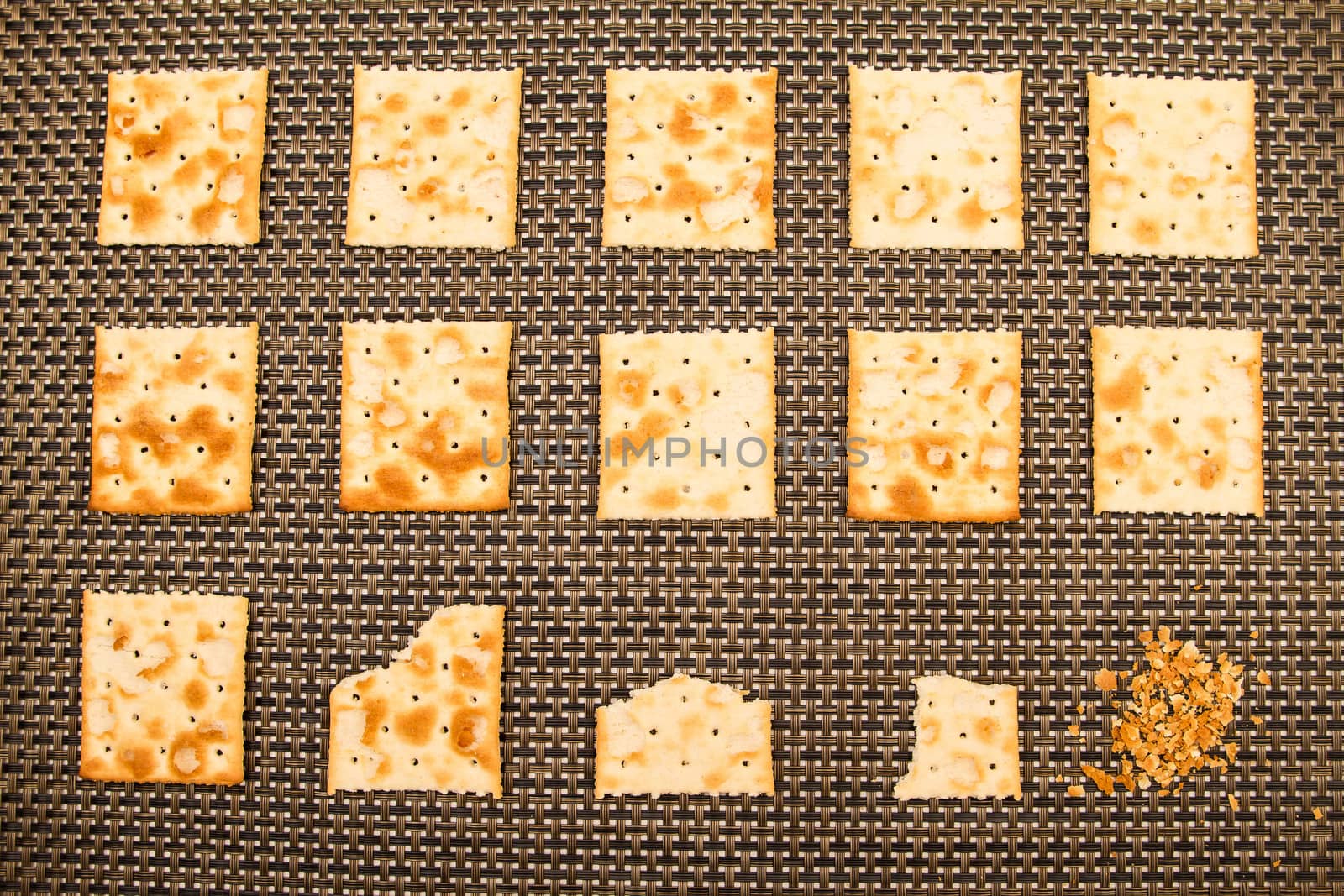 Salted crackers bitten process, background