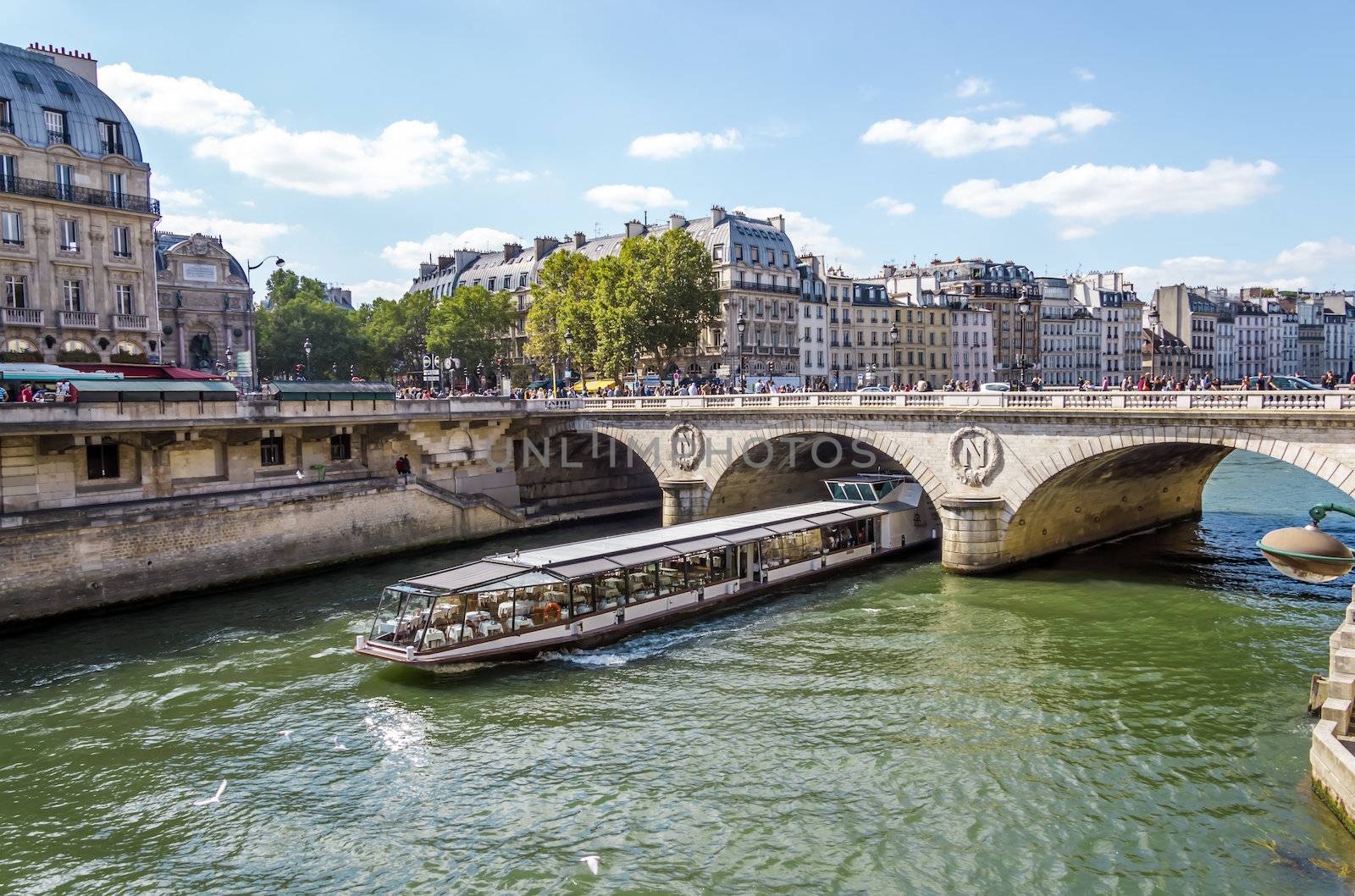 Tourist cruise luxury restaurant boat in River Seine Paris Franc by Tetyana