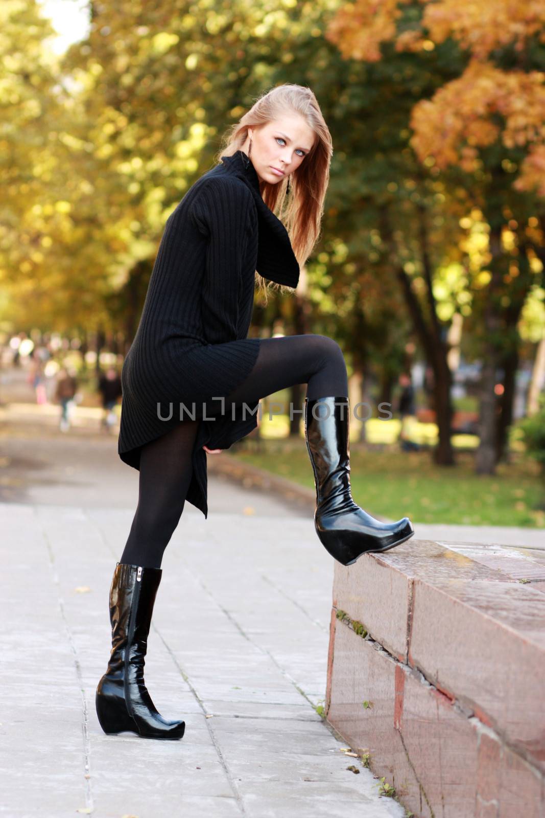 Beautiful woman walking in park by andersonrise