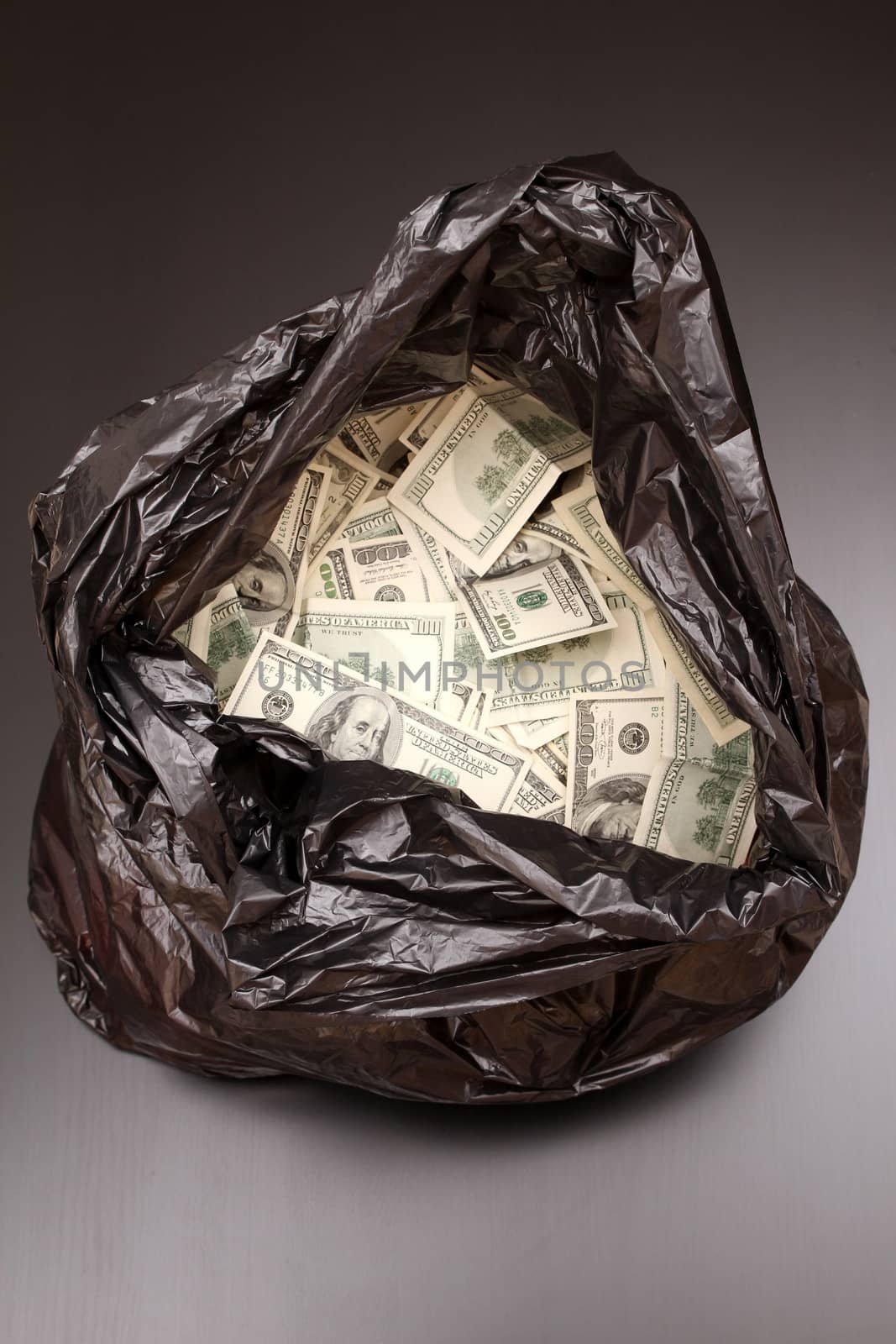 A Rubbish bag full of dollars