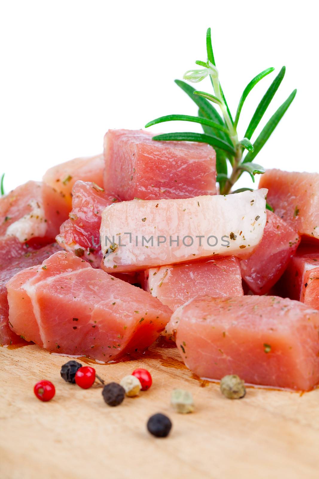 pieces of raw meat on a kitchen board, on a white background