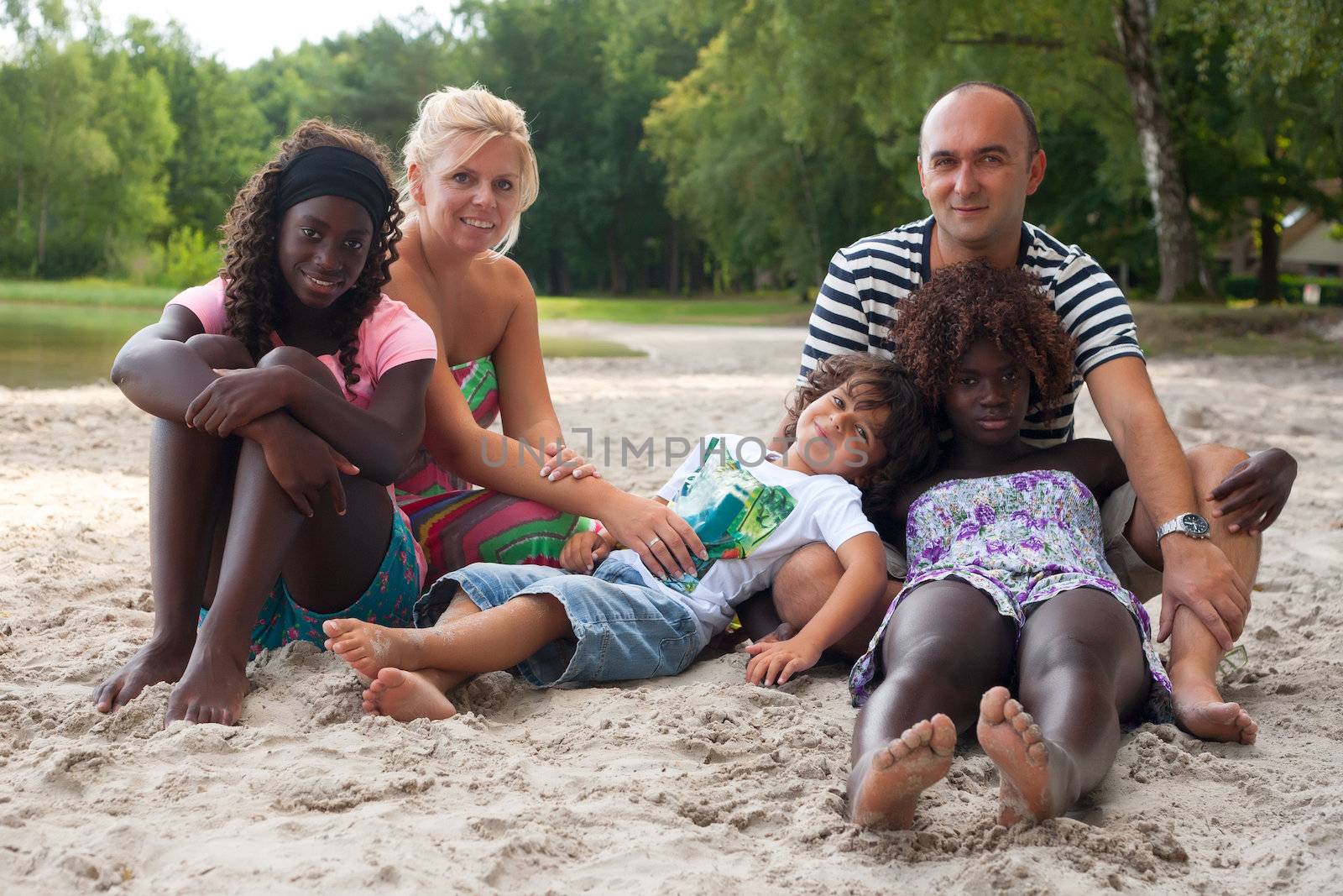 Multicultural family on the beach by DNFStyle