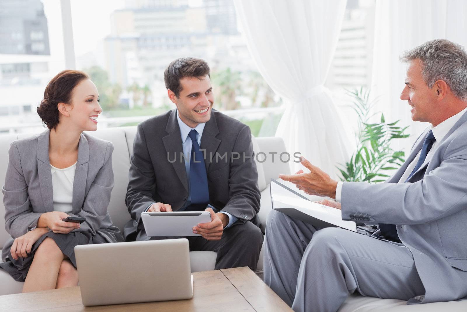 Business people having a meeting in cosy meeting room