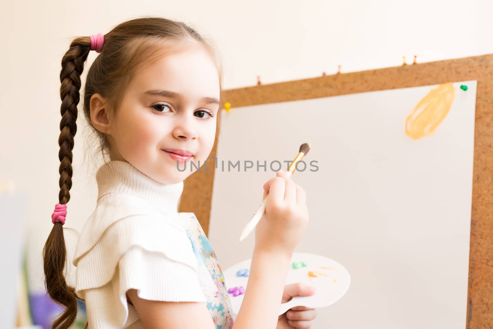 portrait of a girl standing next to his easel, a drawing lesson