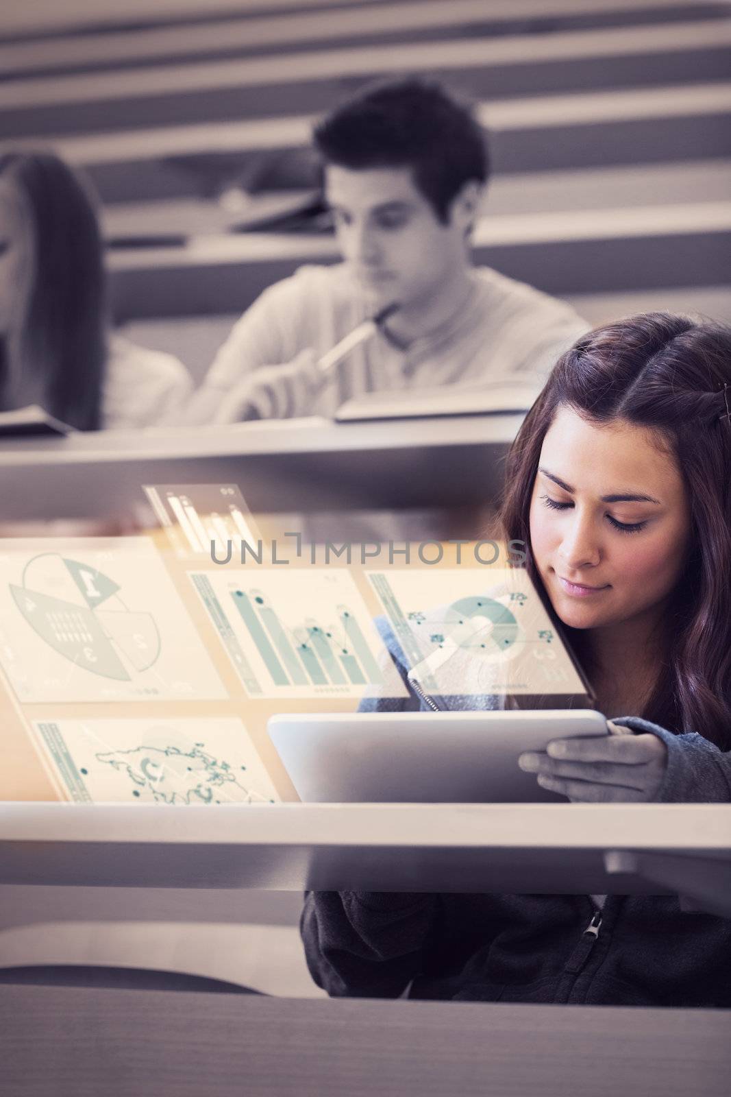 Student analysing graphs on her futuristic tablet computer in lecture hall