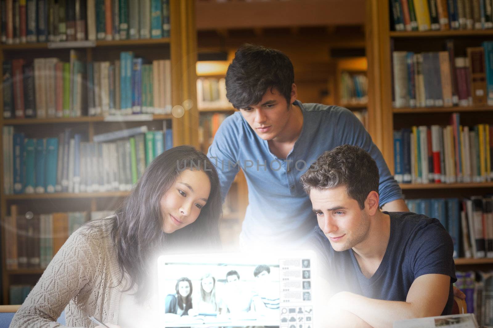 Content students watching pictures on digital interface in university library