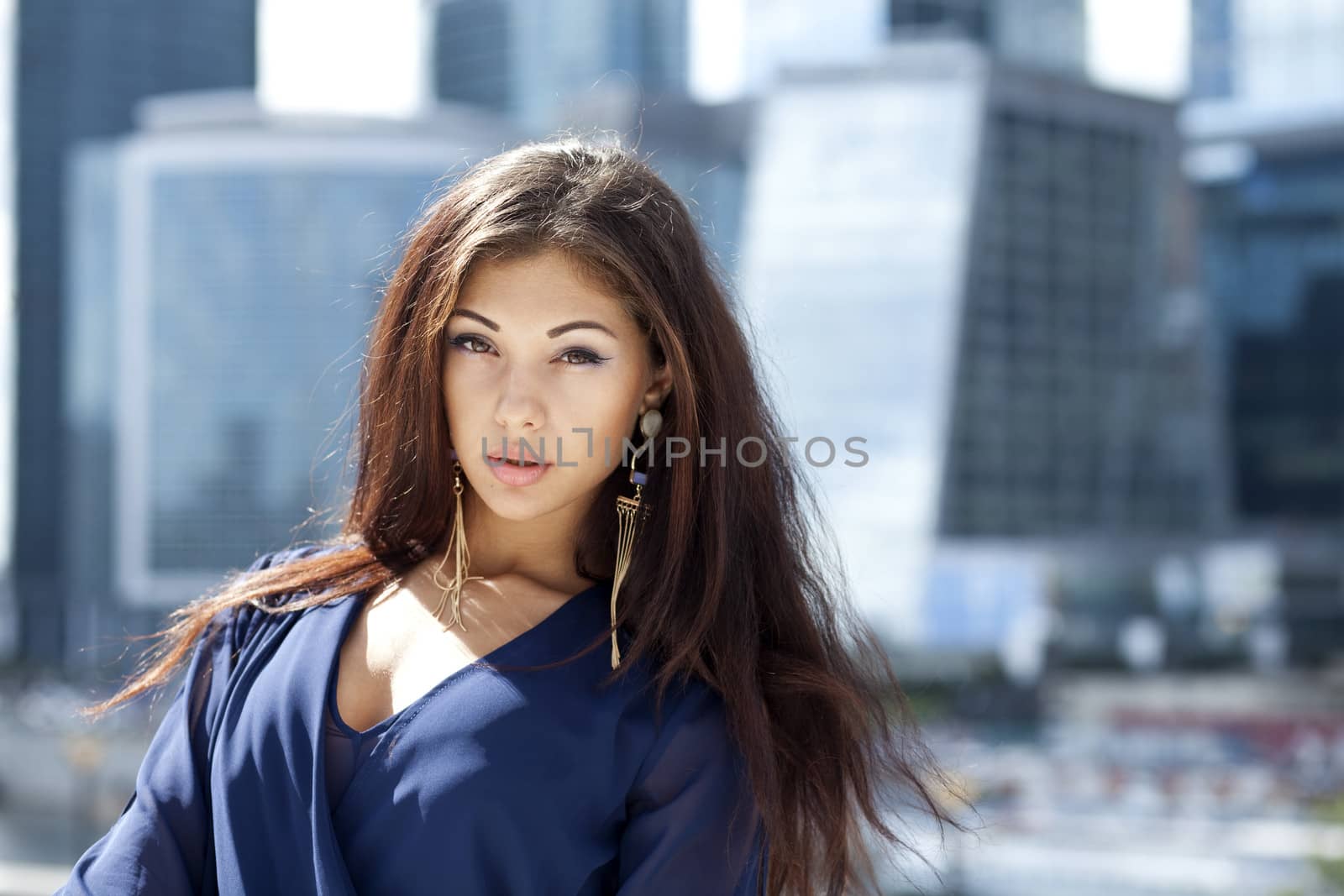 Beautiful young woman in Moscow City by andersonrise