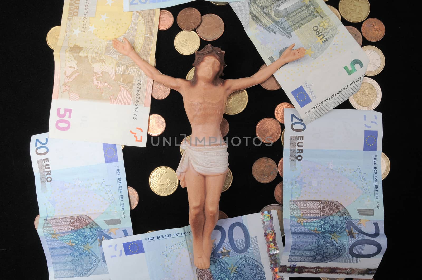 Jesus Christ and Money on a Dark Background - Religion Concept