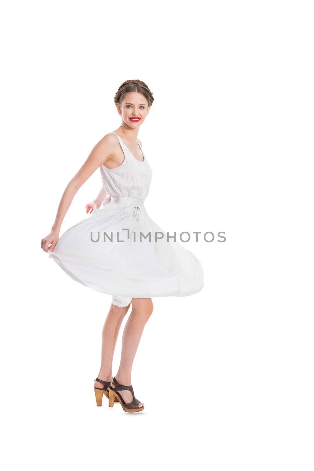 Happy pretty woman in white summer dress posing on white background