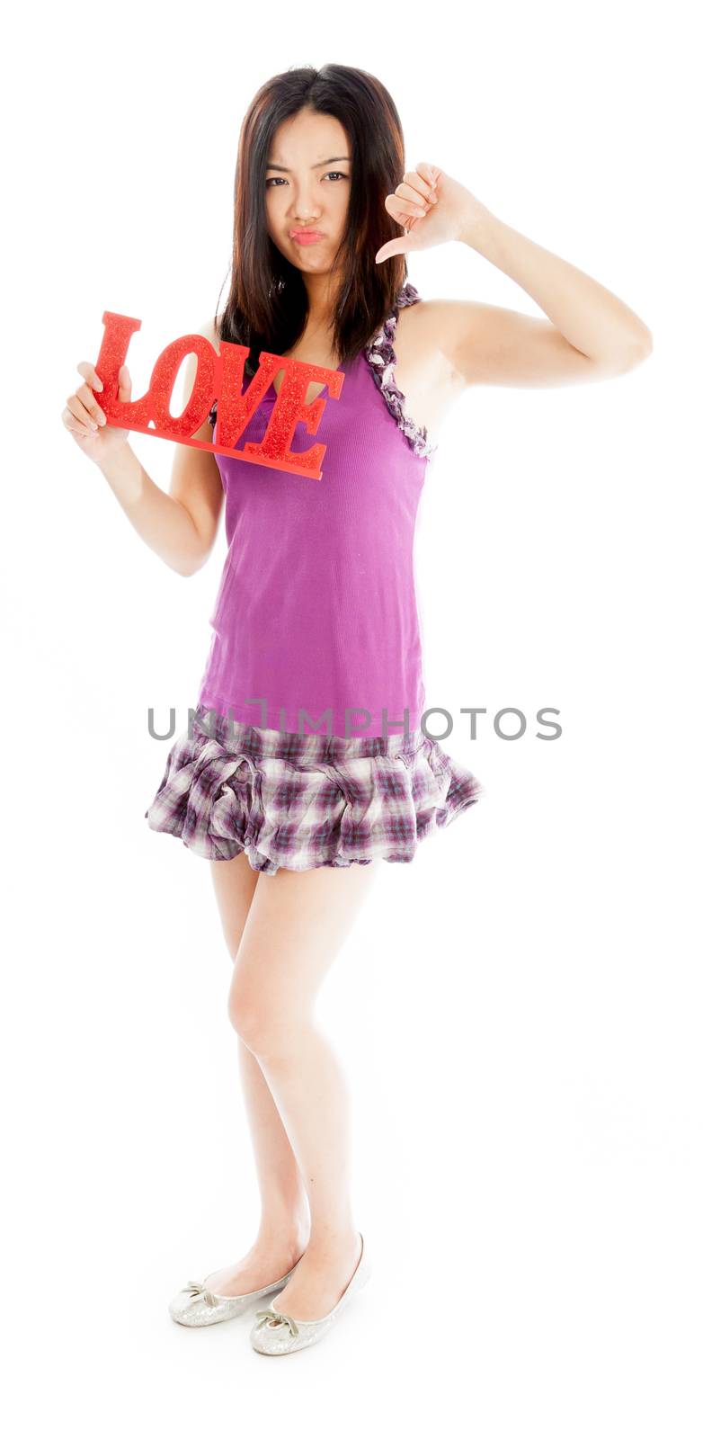 Attractive asian girl in her twenties isolated on a plein background shot in a studio