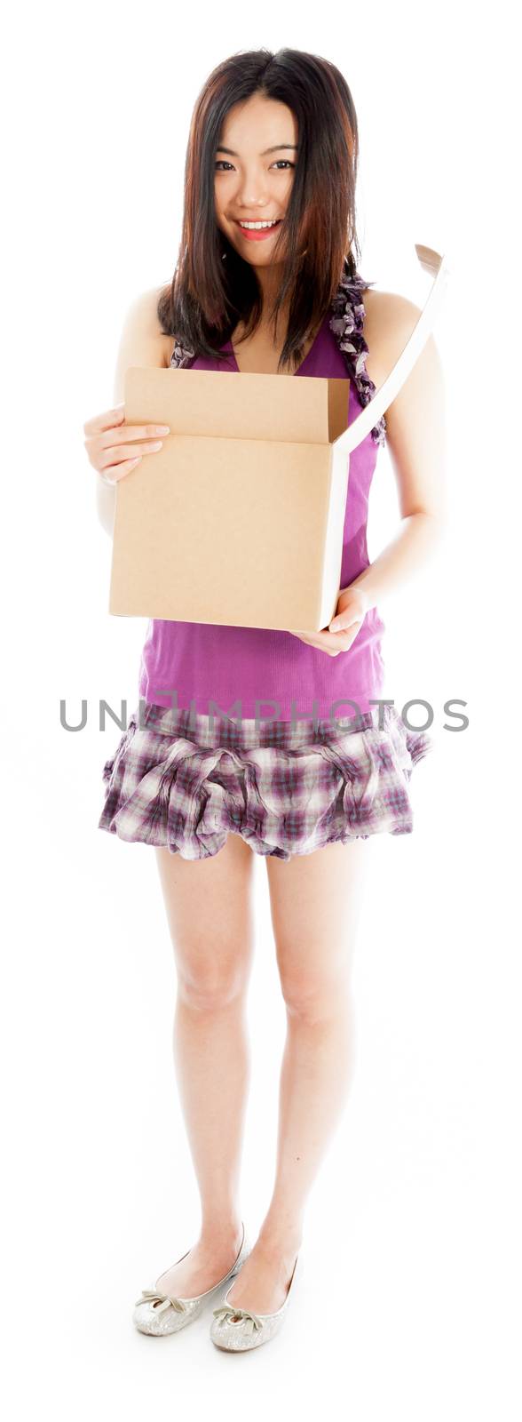 Attractive asian girl in her twenties isolated on a plein background shot in a studio