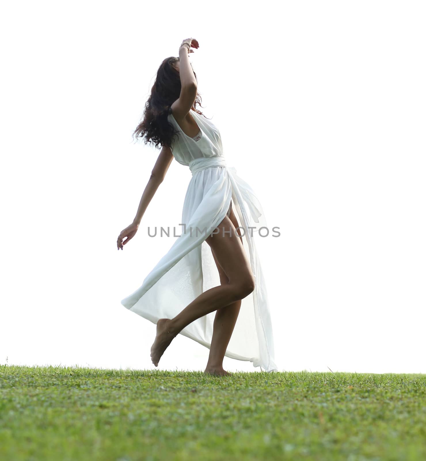 Portrait of young woman in long white dress