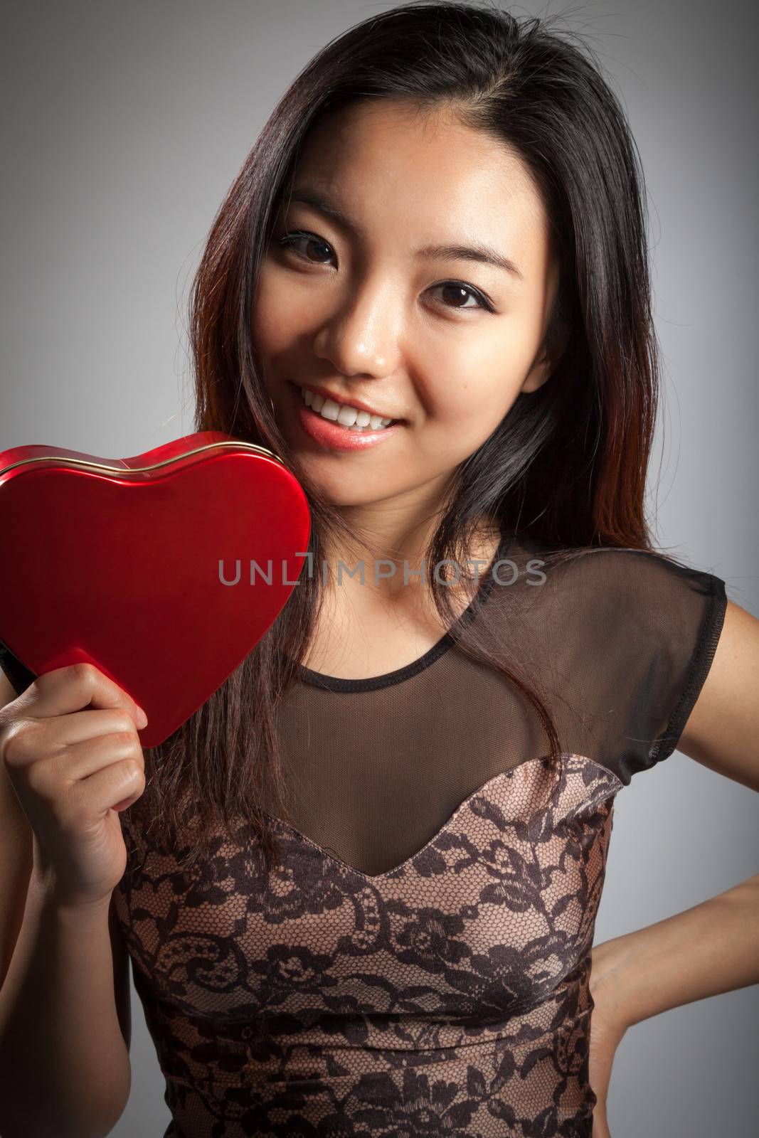 Romantic people in love shot in studio isolated on a grey background