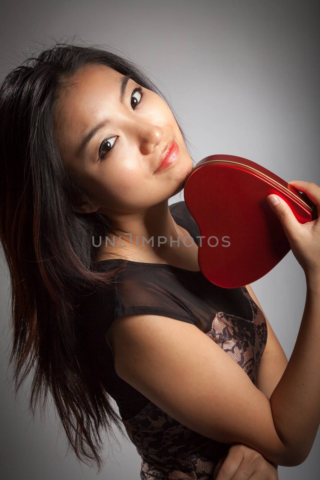 Romantic people in love shot in studio isolated on a grey background