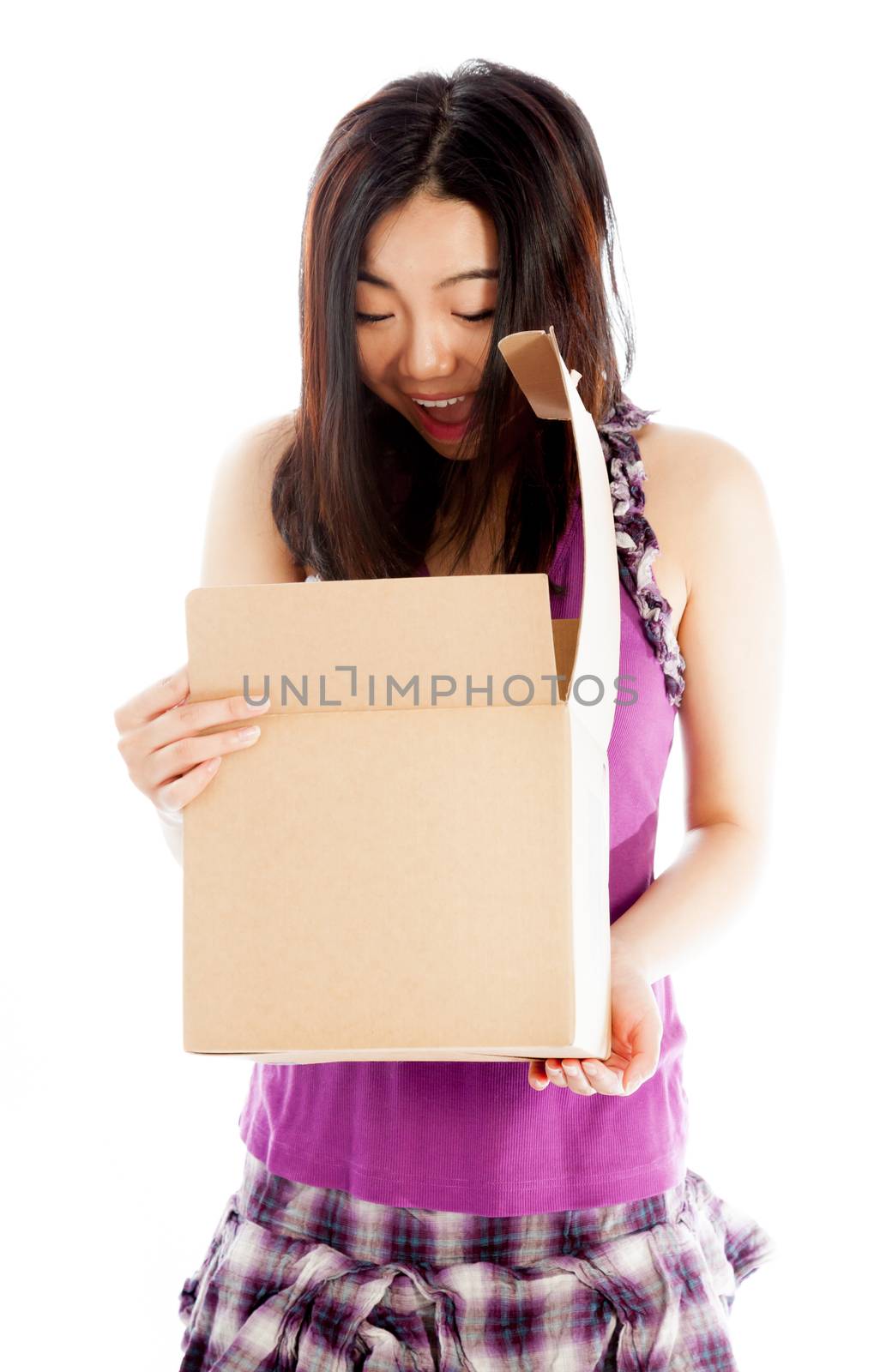 Attractive asian girl in her twenties isolated on a plein background shot in a studio