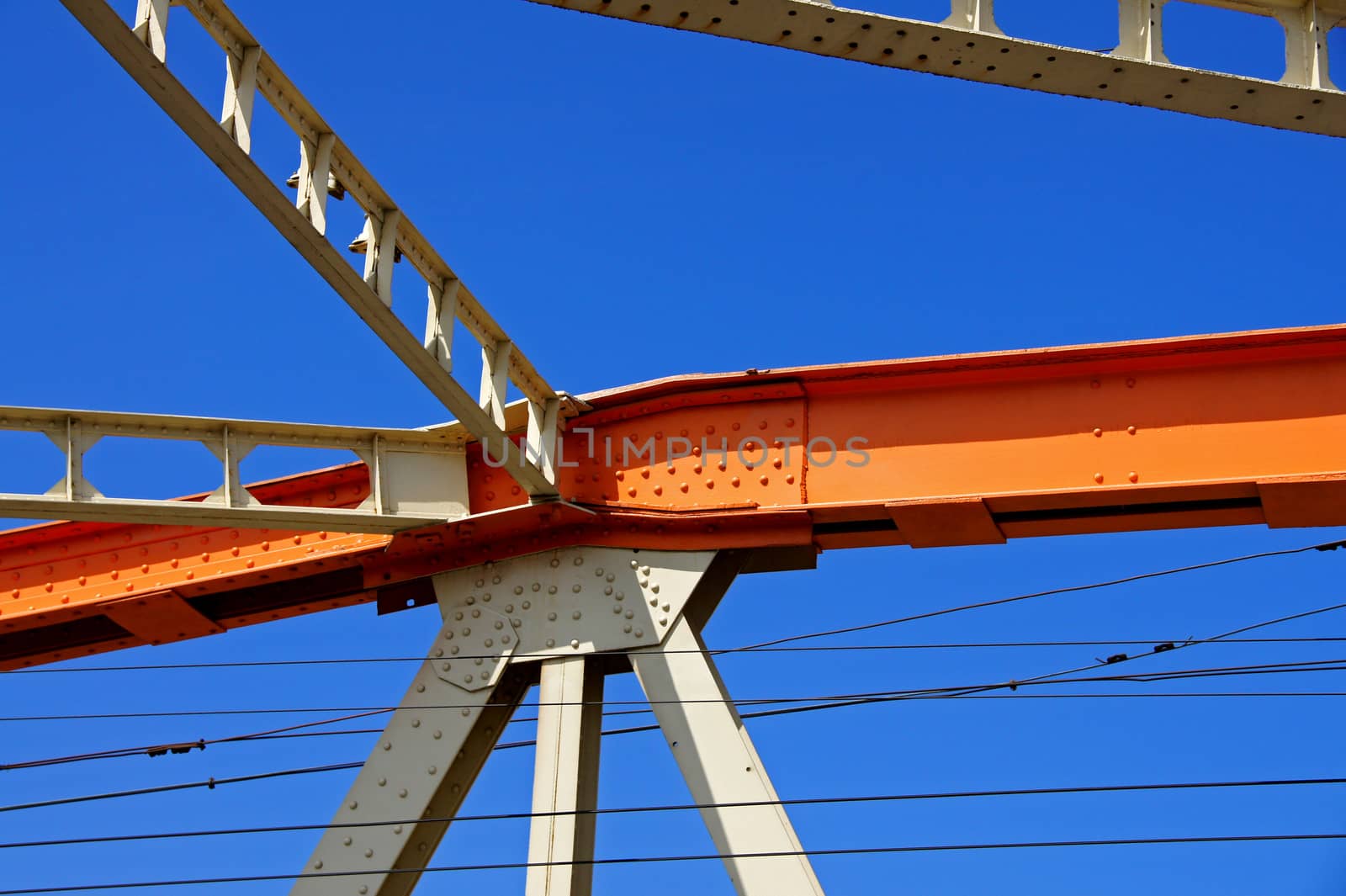 Beams of the bridge on a background of the blue sky