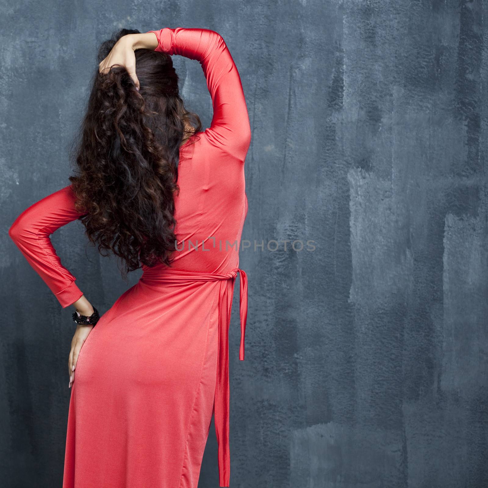 Portrait of back woman in red sexy dress