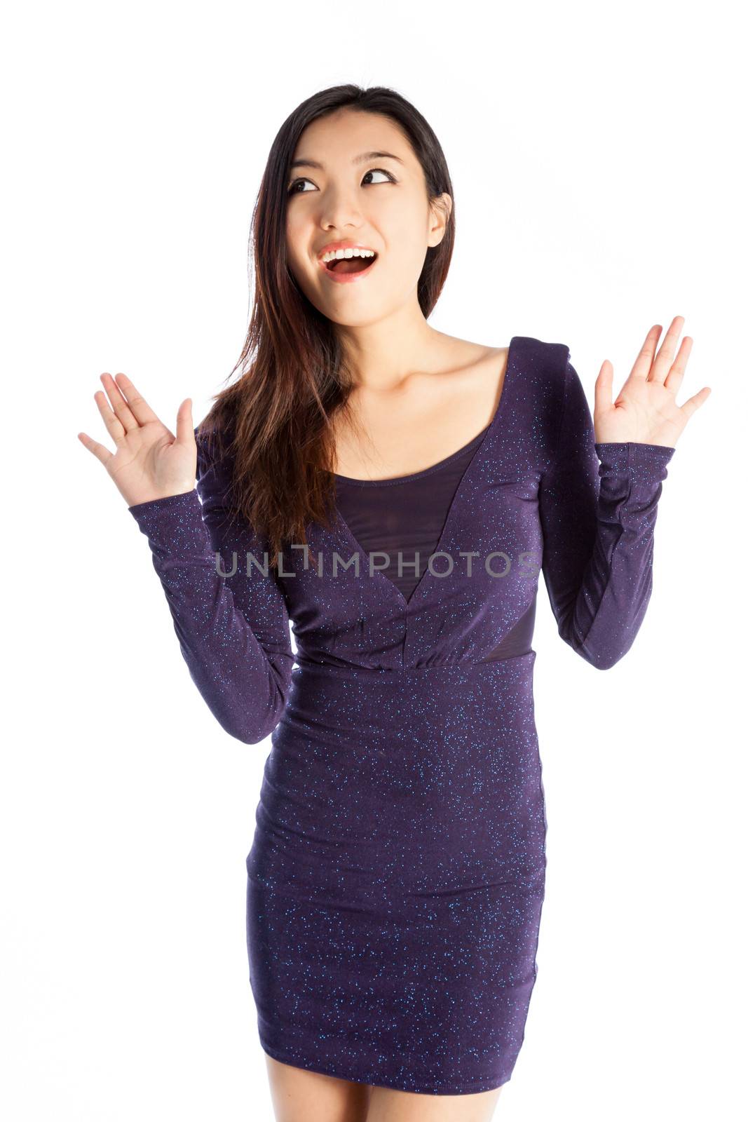 Attractive asian girl in her twenties isolated on a plein background shot in a studio