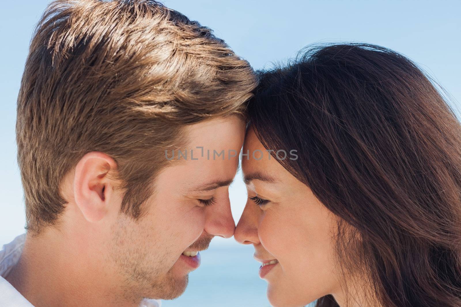 Close up view of romantic couple at beach on holidays