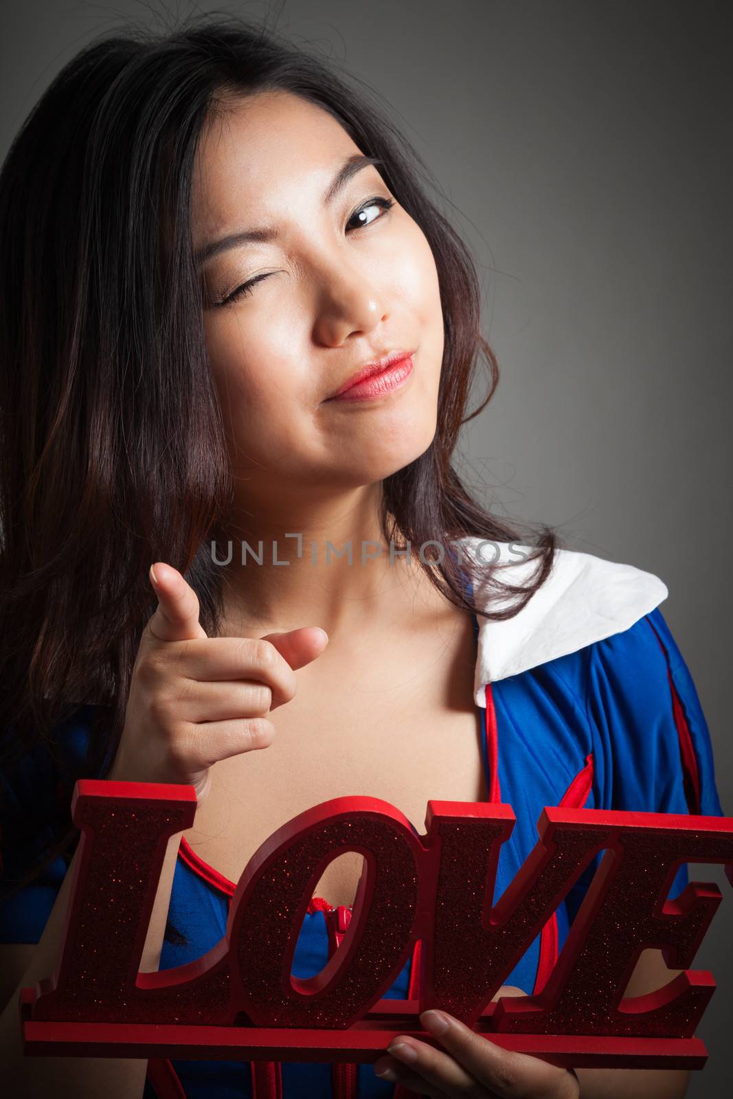 Romantic people in love shot in studio isolated on a grey background