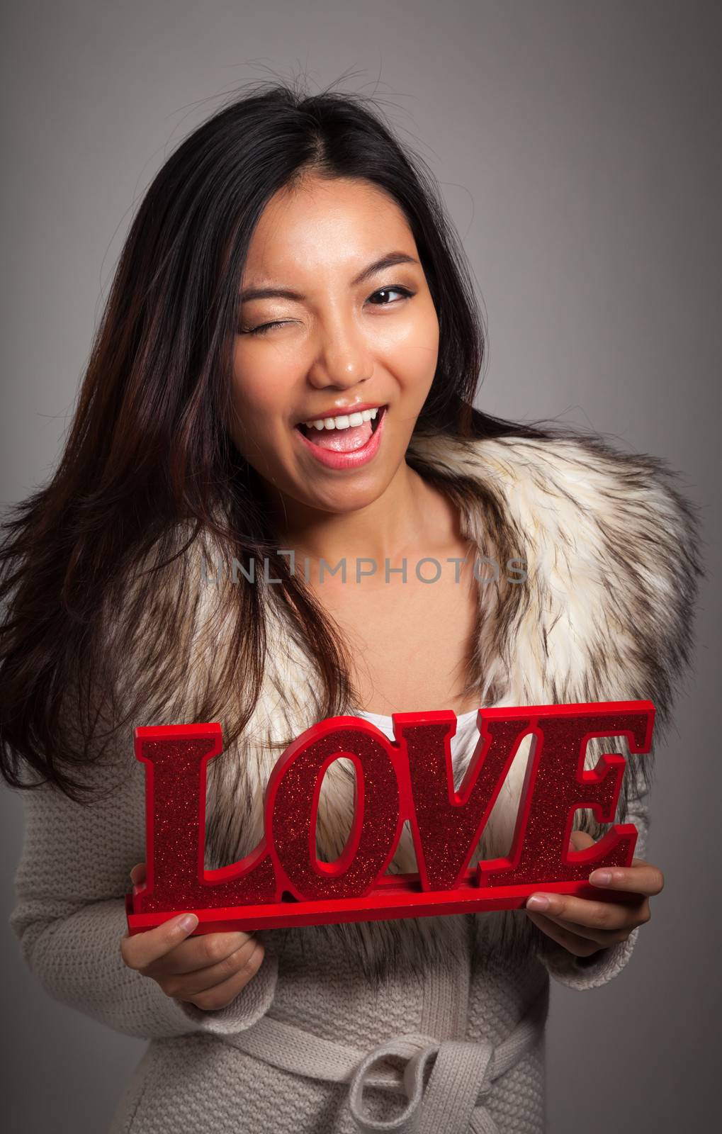 Romantic people in love shot in studio isolated on a grey background