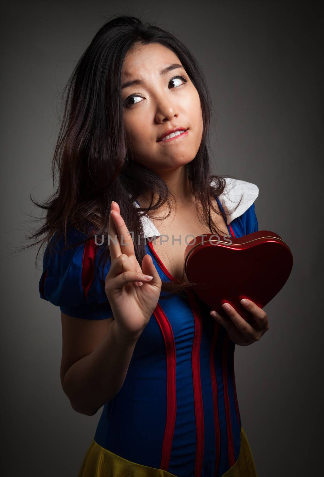 Romantic people in love shot in studio isolated on a grey background