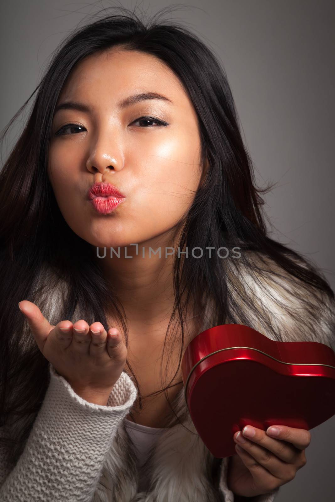 Romantic people in love shot in studio isolated on a grey background