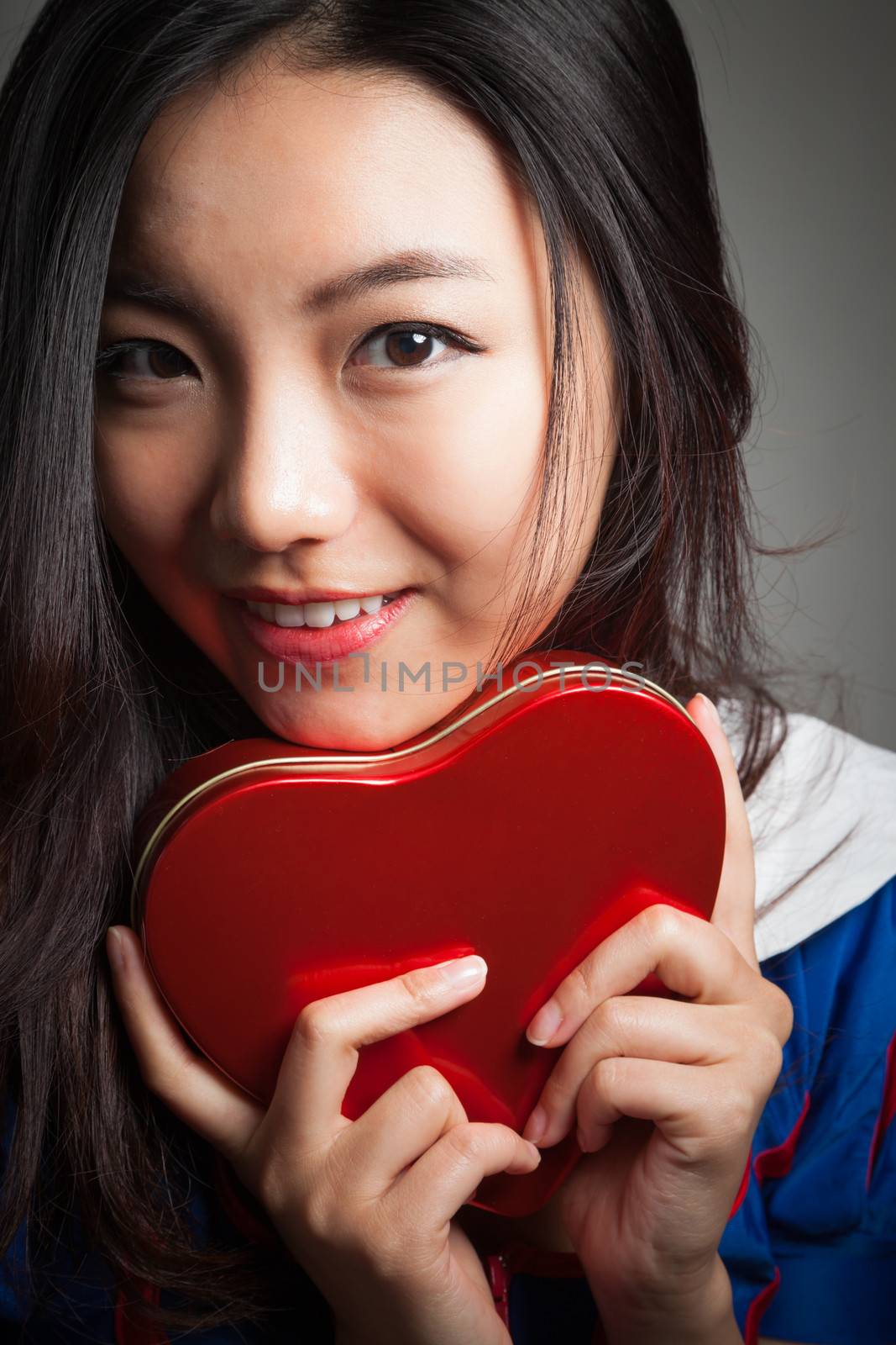 Romantic people in love shot in studio isolated on a grey background