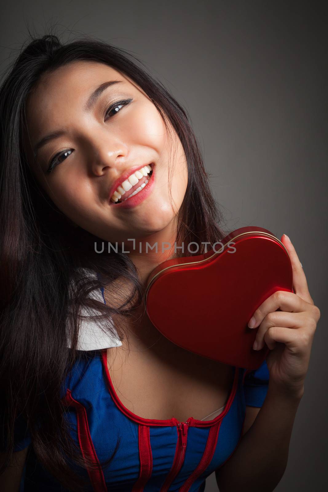 Romantic people in love shot in studio isolated on a grey background