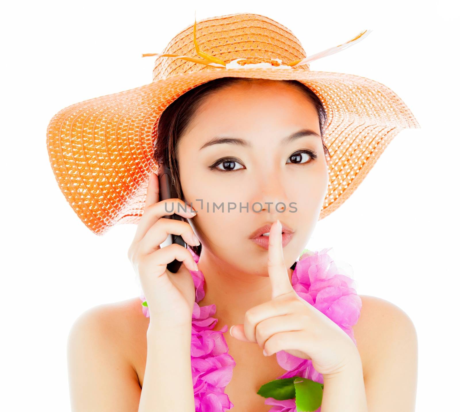 Attractive asian girl in her twenties isolated on a plein background shot in a studio