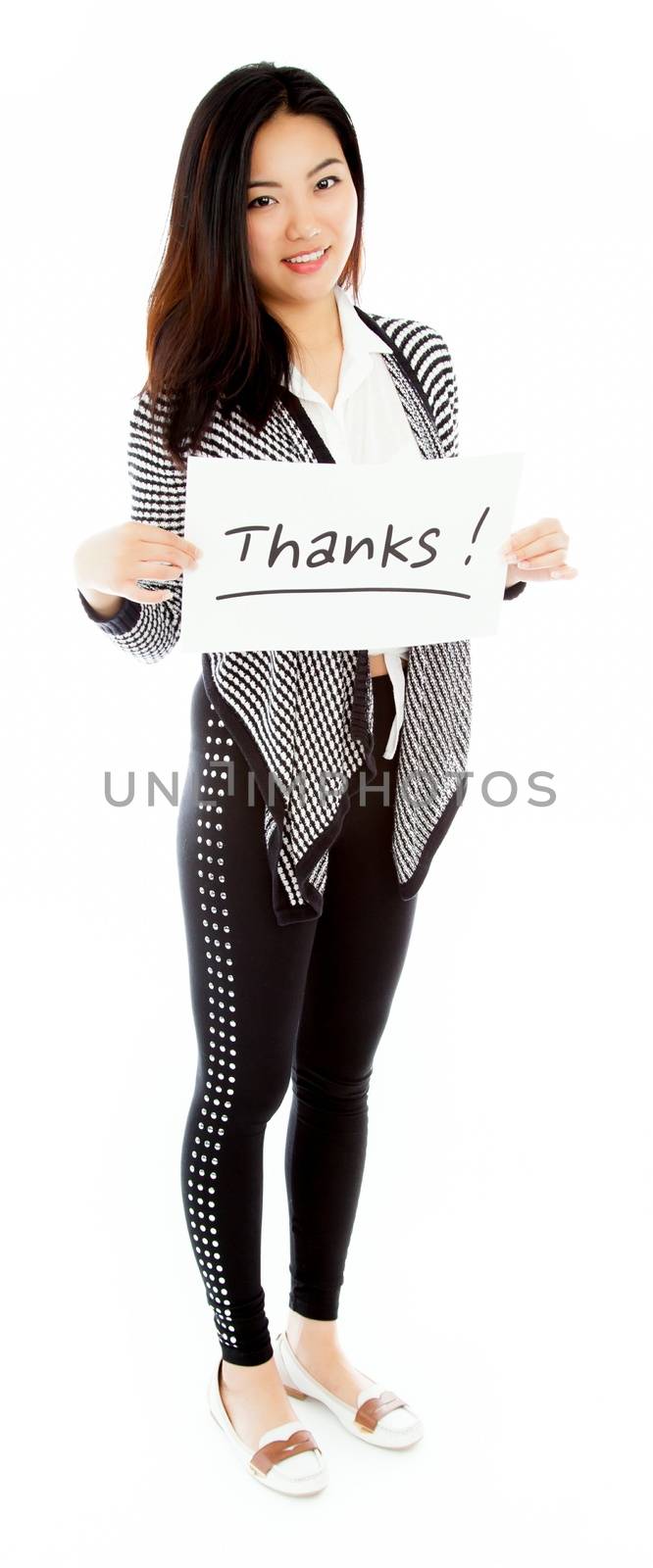 Attractive asian girl in her twenties isolated on a plein background shot in a studio