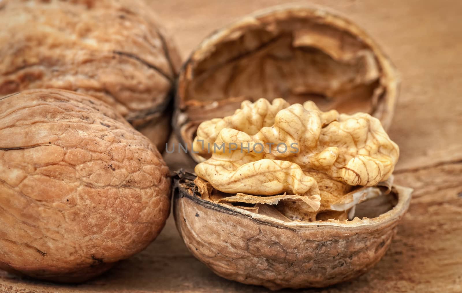 Walnuts on old wooden background