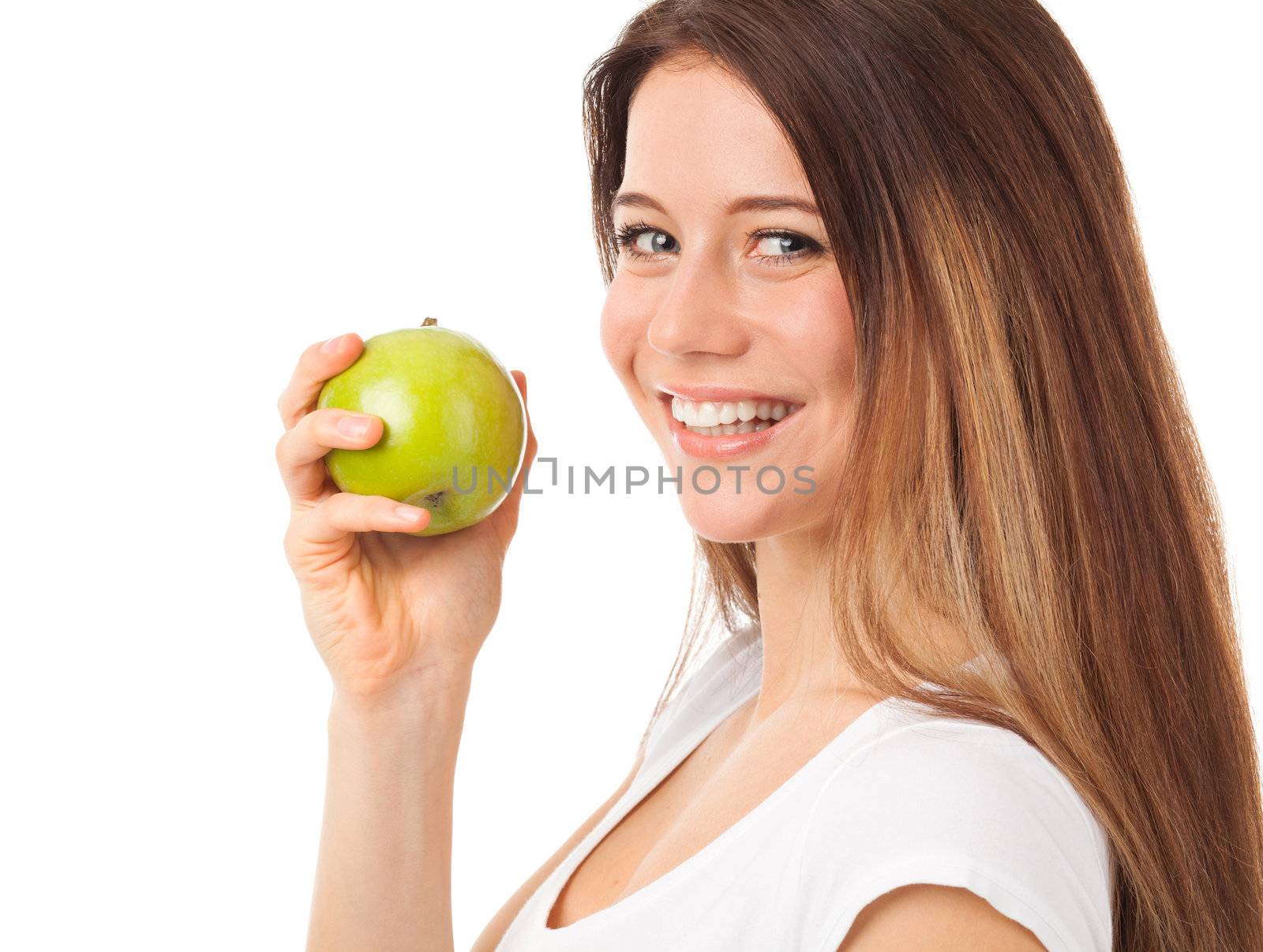 Nice young woman holding a green apple, isolated on white