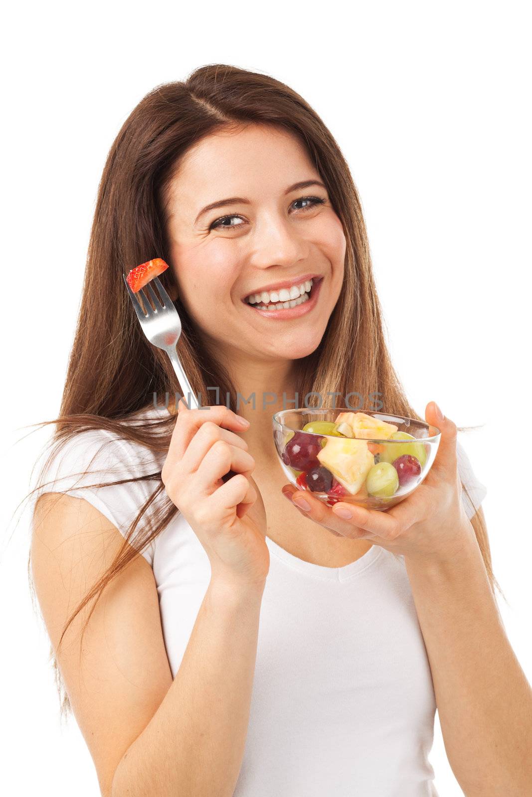 Portrait of a beautiful woman eating fruits, isolated on white