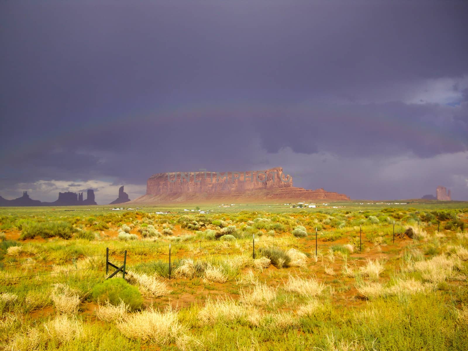 Bright sunshine and rainbow after the storm by emattil