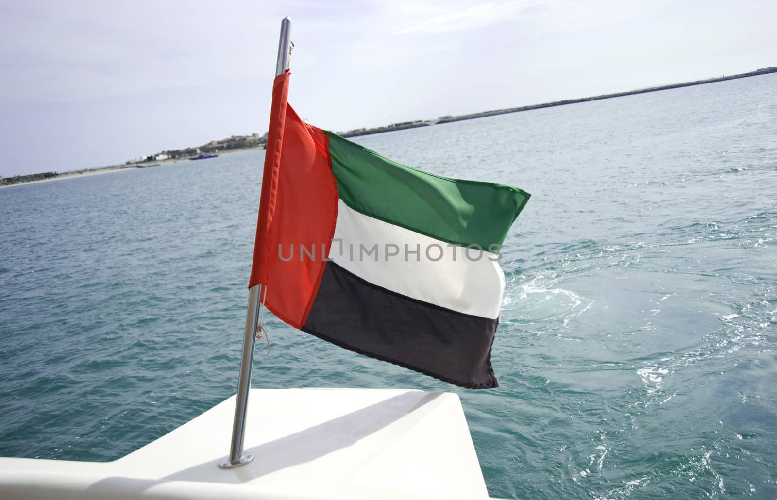 UAE flag on a boat blowing in the wind
