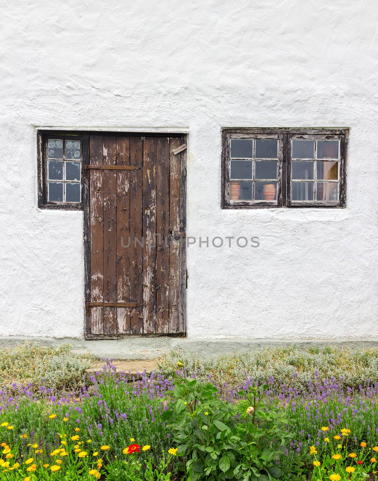 Facade of a rustic house by anikasalsera